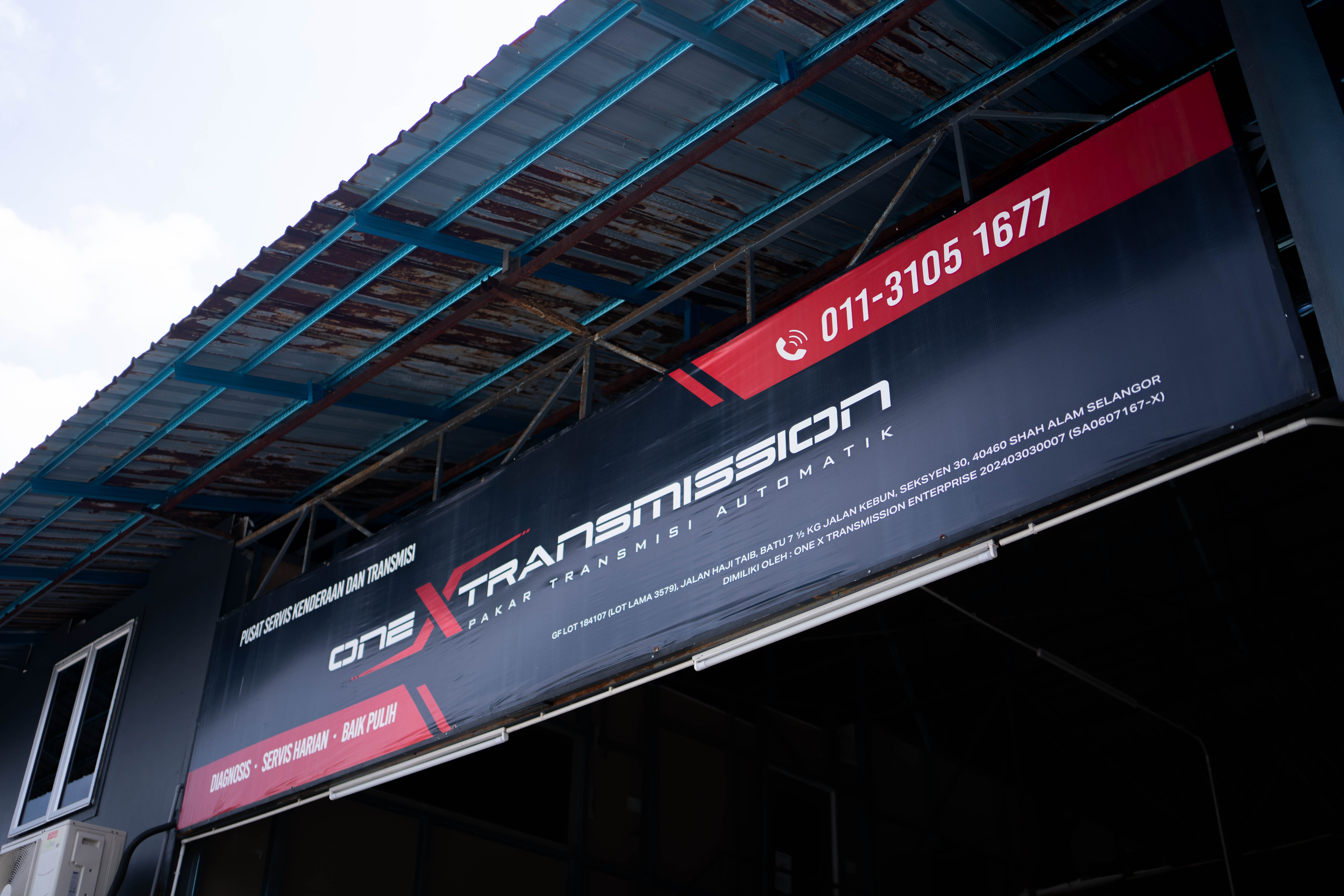 One X Transmission signage and service bay